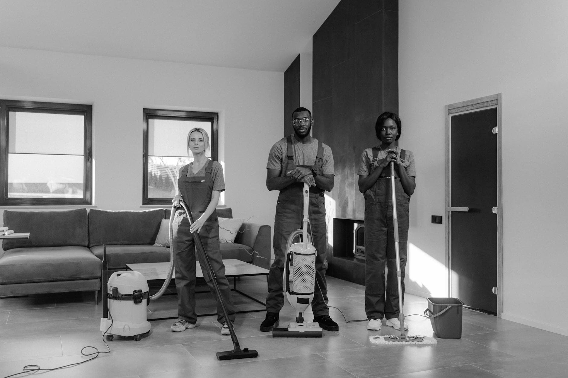 Three professional Your Business cleaners in uniform with equipment, ready for a job — Office Cleaning in DUMBO, Brooklyn